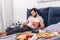 handsome loner sleeping with popcorn and remote control