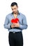 Handsome macho man holding love heart portrait - isolated