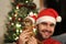 Handsome male with his cat during christmas