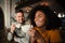 Handsome male joking with beautiful woman over a cup of warm coffee at a chic cafe