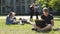 Handsome male student studying with laptop in park