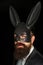 Handsome man with beard in playboy mask. Hipster with moustache. Handsome stylish bearded man. Serious man with beard in