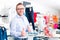 Handsome Man buying blue jeans in shop