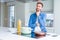 Handsome man cooking italian spaghetti pasta at the kitchen with hand on chin thinking about question, pensive expression