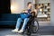 Handsome man with a disability sitting in wheelchair playing on guitar at home