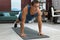 Handsome man doing high plank exercise on floor at home