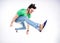 Handsome man dressed casual jumping and smiling - dynamic wide shot