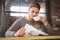 Handsome man drinking coffee and reading newspaper