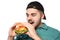 Handsome man eating tasty burger