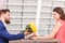 Handsome man giving flowers to his girlfriend