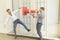 Handsome man hold traffic cone and shouting at friend until he is shocked