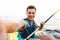 Handsome man kayaking on lake sea in boat make selfie by camera.
