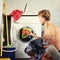 Handsome man loads in the washing machine dirty clothes. Bachelor housework, male housewife concept