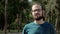 Handsome man portrait looking at camera. Face with beard and eyeglasses