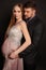 Handsome man posing with gorgeous pregnant woman