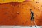 Handsome man posing near climbing wall