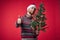 handsome man in a santa hat Christmas decorations holiday New Year studio posing