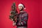 handsome man in a santa hat Christmas decorations holiday New Year studio posing