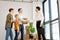 Handsome man shaking hands with real estate agent in new apartment