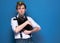 Handsome man in shirt and homemade golden crown holding cute black cat