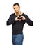 Handsome man shows heart with their hands. Isolated