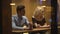 Handsome man sitting in restaurant and flirting with blond woman, relationship