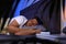 Handsome man sleeping on pillow in dark room at night