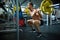 Handsome Man Squatting with Barbell