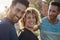 Handsome man standing with friends outside laughing