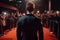 Handsome Man In Suit Stands Backwards On The Red Carpet In Front Of The Paparazzi. Generative AI