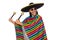 Handsome man in vivid poncho holding maracas