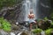 Handsome man at waterfall