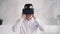 Handsome man wearing virtual reality helmet on head
