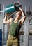 Handsome manual worker holding gas tank over his head