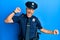 Handsome middle age mature man wearing police uniform dancing happy and cheerful, smiling moving casual and confident listening to