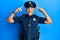 Handsome middle age mature man wearing police uniform smiling pointing to head with both hands finger, great idea or thought, good