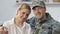 Handsome military agent hugging pretty wife, young couple love, american nation