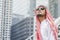 Handsome modern Arabian man standing in modern city wear muslim dress headscarf eastern ethnic smile outside office. Arab Man