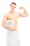 Handsome muscular man in towel holding a weight scale