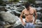 Handsome muscular young man outdoor wearing only towel