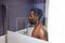 Handsome naked black man takes shower