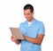 Handsome nurse guy using his tablet pc