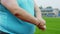 Handsome obese young man stretching hands before start to run in the stadium at the starting line he wearing sports