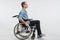 Handsome physically challenged man moving in wheelchair