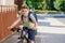 Handsome preteen boy going to school on bike. Teenager ride bicycle. Safe way to high school. Happy child boy with