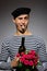 Handsome romantic man with rose flower and vine