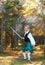 Handsome scottish man with sword in the forest