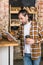 Handsome seller holding digital tablet and paper cup