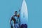 Handsome serfer man with serf board. Male fit with athletic body. Surfboard man with serf board. Surfer with a surfboard