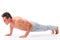 Handsome shirtless bodybuilder doing push-ups in